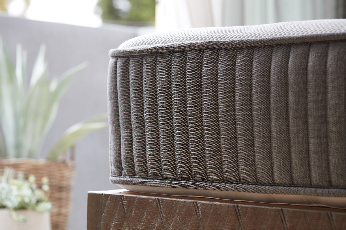 Side view of a charcoal-infused memory foam mattress made by Brentwood Home