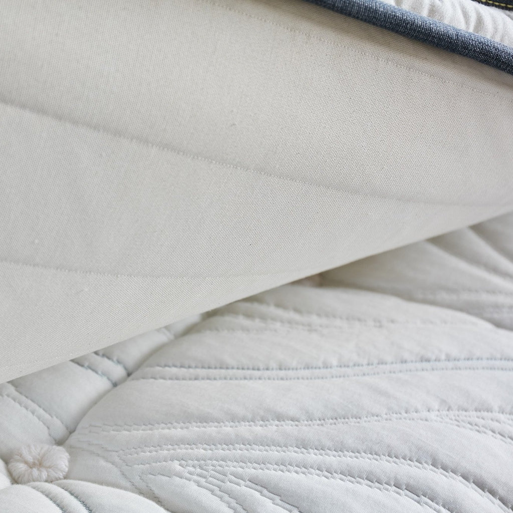Memory foam mattress topper on top of a natural mattress made by Brentwood Home